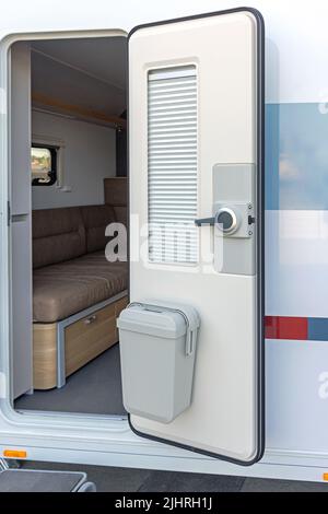 Door Mounted Trash Can With Lid Camper Van Stock Photo