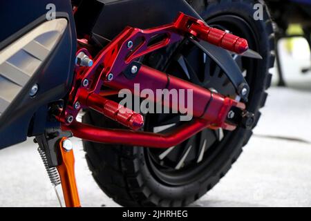 Sport electric motorcycle or side view of a new red electric motorbike with stand on Stock Photo