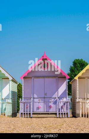 Beach holiday, view in summer of a colorful beach hut under a clear blue sky. Stock Photo