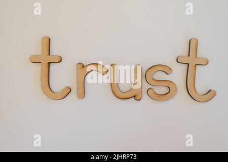 A word Trust made with wooden letters Stock Photo