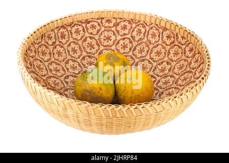 tangerine in wicker baskets isolated on white background. Stock Photo