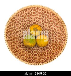 tangerine in wicker baskets isolated on white background. Stock Photo