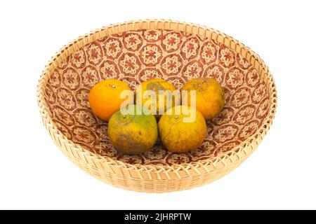 tangerine in wicker baskets isolated on white background. Stock Photo