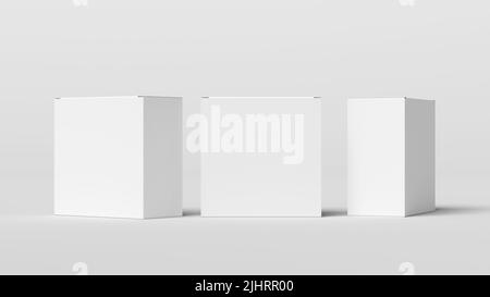 Three square boxes mock up. White gift boxes on white background. Front view Stock Photo