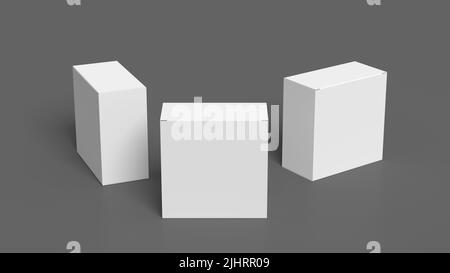 Three square boxes mock up. White gift boxes on gray background. Front view Stock Photo