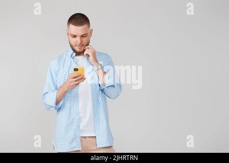 handsome man with mobile cell phone surfing internet Stock Photo