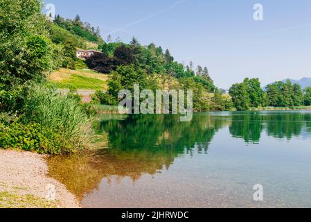 Lago di Caldonazzo is a lake in Trentino it is located in the valley communities of Alta Valsugana e Bersntol. The Valsugana or Sugana Valley. San Cri Stock Photo