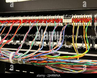 A closeup of plugged in colorful cables Stock Photo