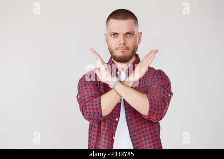 Young bearded man making stop gesture hand Stock Photo