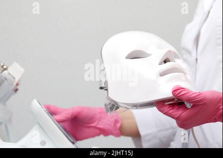 photon mask. Health and beauty. Cosmetic procedure for woman face. Beauty laboratory. LED Facial Mask, Photon Therapy Stock Photo