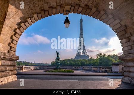 Paris, France - April 2019: Sunrise in Paris with Eiffel Tower view from Pont de Bir-Hakeim. Stock Photo