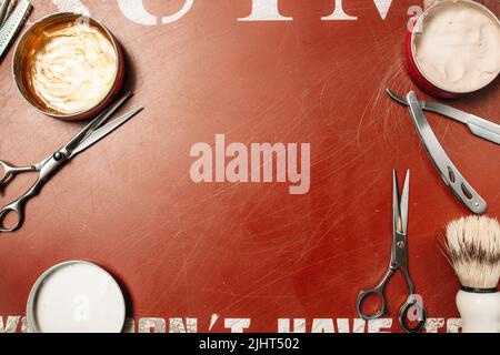 Barber tools frame on red background flat lay Stock Photo