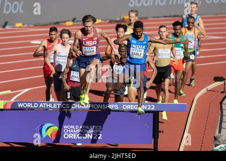 Evan Jager (USA) and Avinash Mukund Sable (IND) lead the pack as they jump the water barrier in the 3000 meter steeplechase during the afternoon sessi Stock Photo