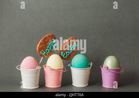 Color eggs in buckets. Happy easter background. Stock Photo