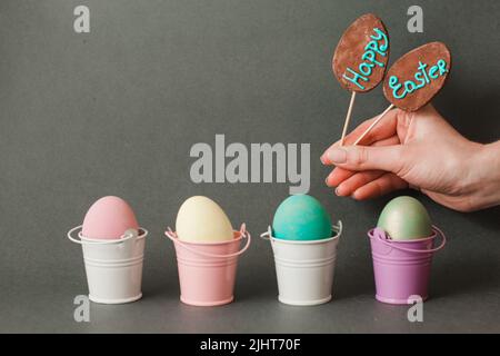 Color eggs in buckets. Happy easter background. Stock Photo