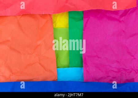 orange. red. pink. blue. green. yellow. sky. crumpled paper texture background. Stock Photo