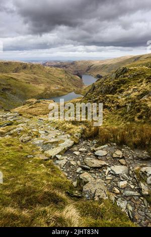 Nan Bield Pass bridleway above Small Water Tarn and Haweswater Reservoir in the Lake District National Park, Cumbria, England. Stock Photo