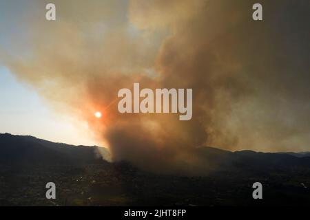 Photographic documentation of a large column of smoke caused by a forest fire in the upper Versilia Tuscany Stock Photo
