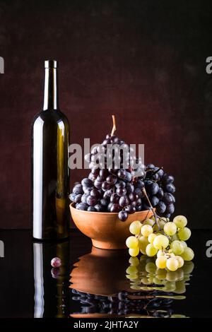 Bright still life with grapes and wine on white Stock Photo - Alamy