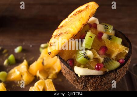 Exotic fruit salad mixed in coconut shell Stock Photo