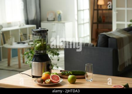 Horizontal image of kitchen table with fresh fruits and vegetables for preparing smoothie in blender Stock Photo