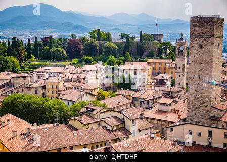 Aerial view of the Upper City with the Gombito Tower (R) in the background the fortress Rocca di Bergamo. Gombito Tower was built in 1200 as a symbol Stock Photo