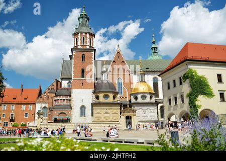 KRAKOW, POLAND - AUGUST 2021: The Wawel Royal Castle, a castle residency located in central Krakow. Tourists exploring the Wawel Hill, the most histor Stock Photo