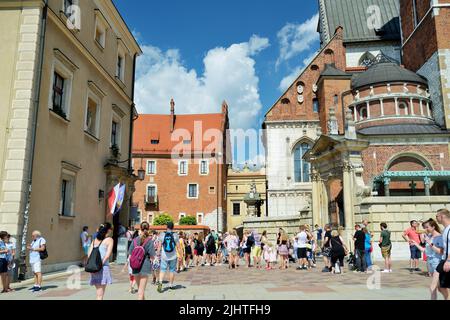 KRAKOW, POLAND - AUGUST 2021: The Wawel Royal Castle, a castle residency located in central Krakow. Tourists exploring the Wawel Hill, the most histor Stock Photo