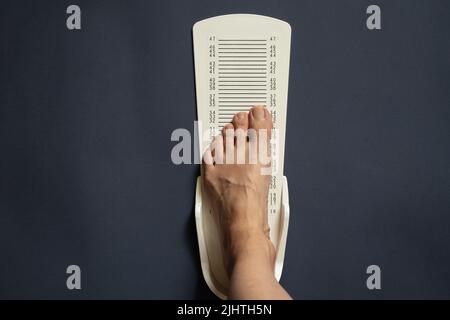 stopwatch for measuring leg length on an isolated background, plastic leg length meter Stock Photo