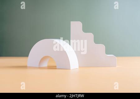 White concrete advertising stands with shadow. Gypsum podium for the presentation of cosmetic products. Stock Photo