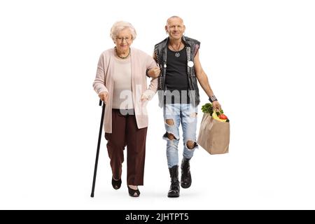 Man holding a senior woman under arm and carrying her grocery bag isolated on white background Stock Photo