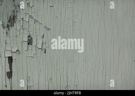 Old white scratched weathered white painted wood wall texture background. Old solid wood peeled slats rustic shabby surface background Stock Photo