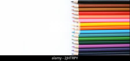 A set of colored pencils isolated on a white background in banner format. Place for text Stock Photo