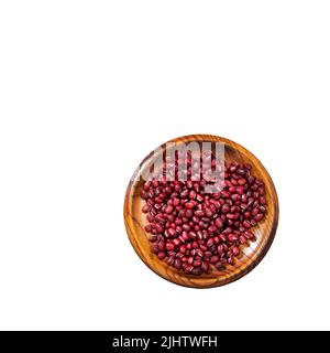 Raw red adzuki beans in the wooden bowl - Vigna angularis Stock Photo