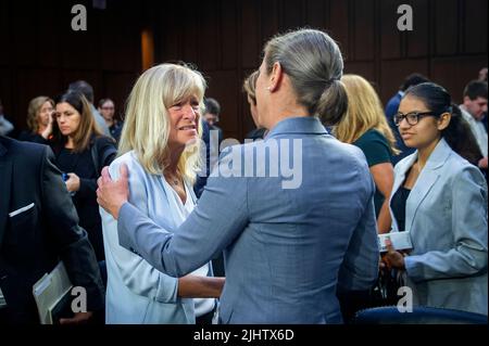 Washington, United States Of America. 20th July, 2022. Highland Park City Councilwoman Annette Lidawer, left, talks with Dr. Kyleanne Hunter, Senior Political Scientist, RAND Corporation, right, following a Senate Committee on the Judiciary hearing to examine the Highland Park attack, focusing on protecting our communities from mass shootings, in the Hart Senate Office Building in Washington, DC, Wednesday, July 20, 2022. Credit: Rod Lamkey/CNP/Sipa USA Credit: Sipa USA/Alamy Live News Stock Photo