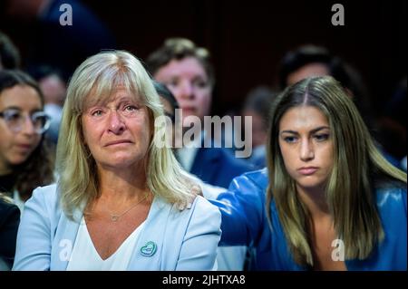 Highland Park City Councilwoman Annette Lidawer, left, is comforted by Allie Rubin, right, while listening to Philip T. Smith, Founder and President National African American Gun Association, offer remarks in support of weapons like the AR-15 and speaking out against bans on AR-15's, during a Senate Committee on the Judiciary hearing to examine the Highland Park attack, focusing on protecting our communities from mass shootings, in the Hart Senate Office Building in Washington, DC, Wednesday, July 20, 2022. Credit: Rod Lamkey/CNP/Sipa USA Stock Photo