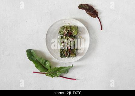 rolls with beet leaves served on the plate. A Vegetarian Cooking, top view, copy space Stock Photo