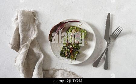 rolls with beet leaves served on the plate with a cutlary. A Vegetarian Cooking, top view, copy space Stock Photo