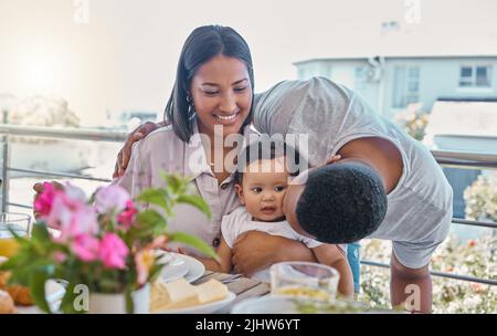 My two favourite girls. a young family having lunch together at home. Stock Photo