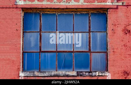 An old window is pictured at the old Mobile County Co-Op, July 17, 2022, in Grand Bay, Alabama. Stock Photo