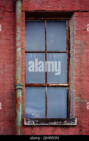 An old window is pictured at the old Mobile County Co-Op, July 17, 2022, in Grand Bay, Alabama. Stock Photo