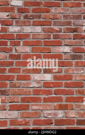 Close-up of a uneven colored brick wall. Stock Photo
