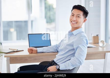 Ive got work to do. a young businessman using a laptop at work. Stock Photo