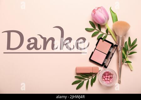 Decorative cosmetics, flower and word DANKE (German for Thanks) on light color background Stock Photo
