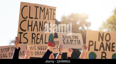 We will not be silenced. a group of people protesting climate change. Stock Photo