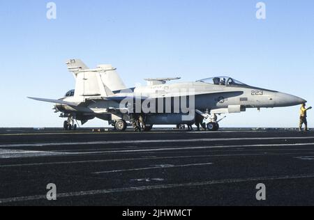 United States Marine Corps F/A-18C from VMFAT-101 moves on carrier deck after landing Stock Photo