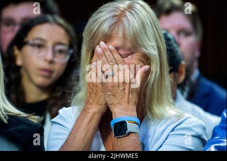 Highland Park City Councilwoman Annette Lidawer cries while listening to Philip T. Smith, Founder and President National African American Gun Association, offer remarks in support of weapons like the AR-15 and speaking out against bans on AR-15’s, during a Senate Committee on the Judiciary hearing to examine the Highland Park attack, focusing on protecting our communities from mass shootings, in the Hart Senate Office Building in Washington, DC, USA? Wednesday, July 20, 2022. Photo by Rod Lamkey/CNP/ABACAPRESS.COM Stock Photo