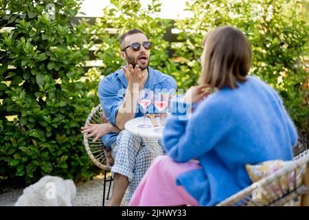 Stylish couple spend romantic evening at backyard Stock Photo