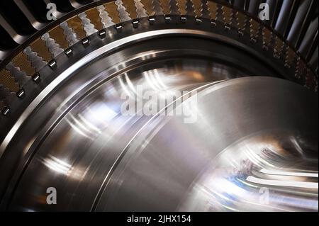 Powerful steam turbine shaft with installed long blades Stock Photo