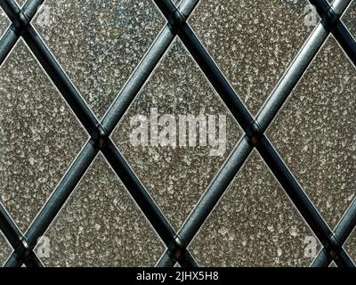 Backlit view of sahara dust on a lattice window, Cambridgeshire, England Stock Photo